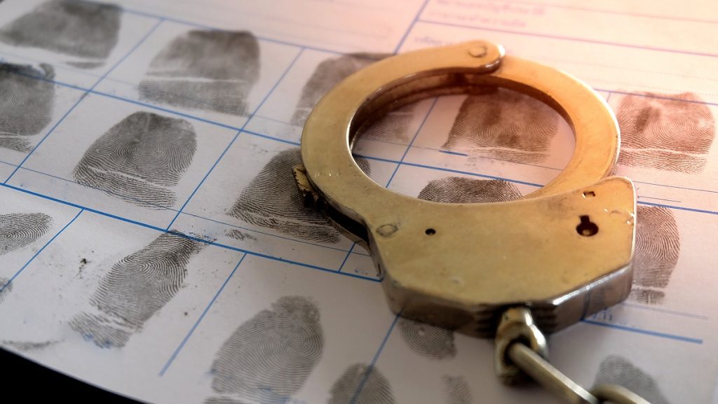 image of handcuff and fingerprints
